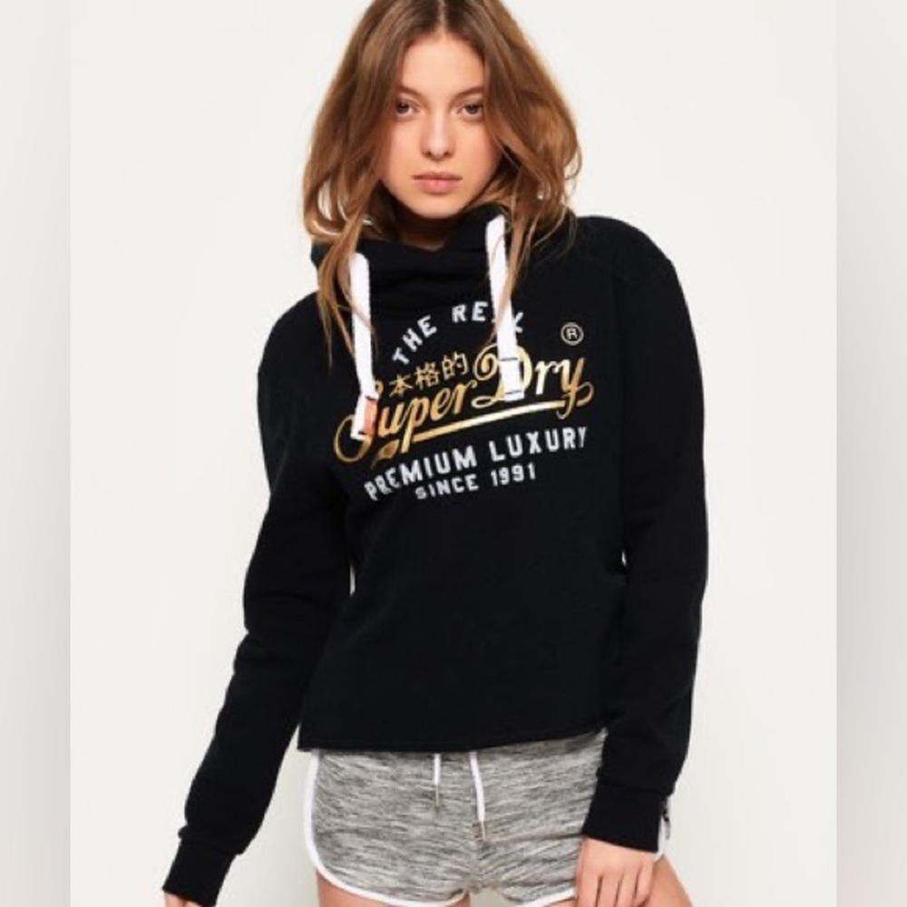 Superdry women’s Luxury embossed Gold Foil crop hoodie and an unfinished hem.